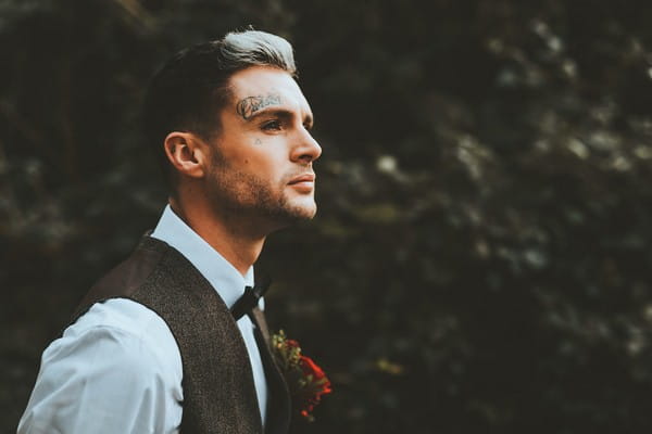Groom with tattoo on face