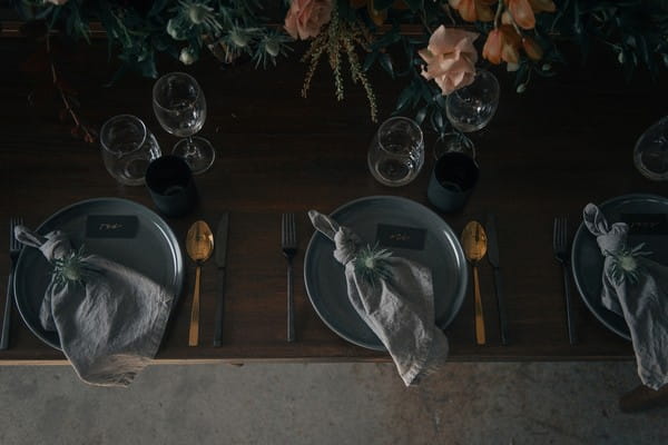 Wedding place settings with grey and gold styling