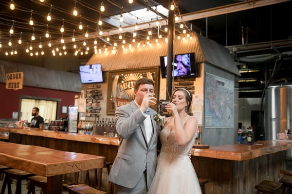 Bride and groom drinking beer in Mt. Lowe Brewery