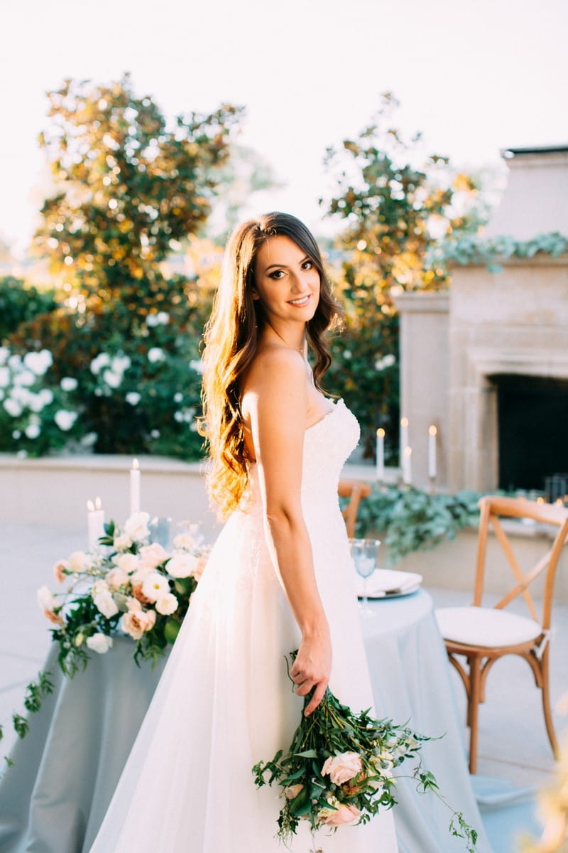 Bride holding bouquet by her side