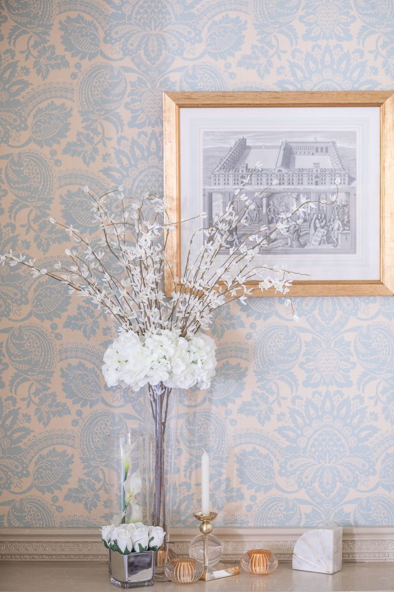 Tall white wedding flower display