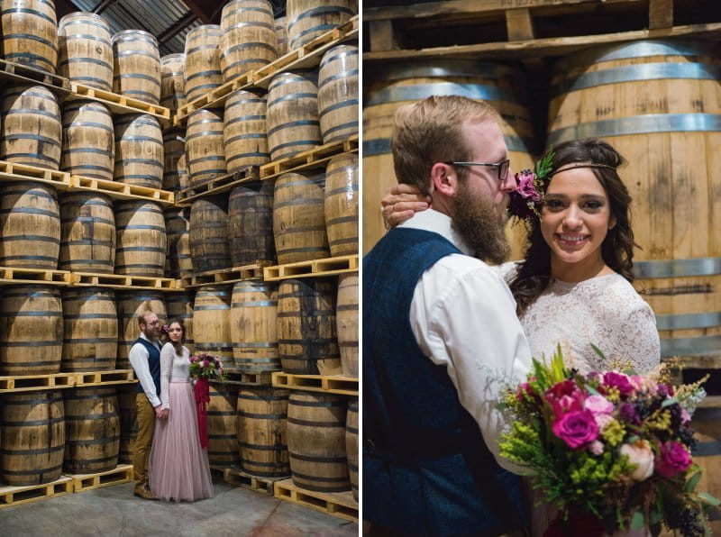 Bride and groom in front of barrels at Breckenridge Distillery