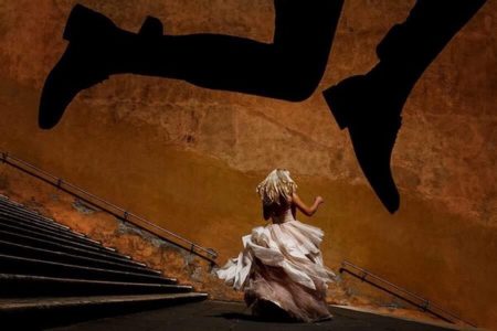 Bride on steps with large shadow of legs over her - Picture by Sabina Mladin Photographer