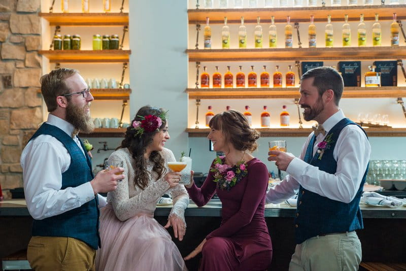 Bridal party having drinks at bar of Breckenridge Distillery