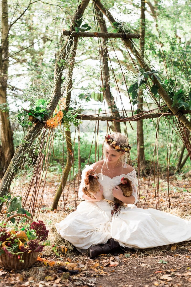 Bride sitting holding chickens