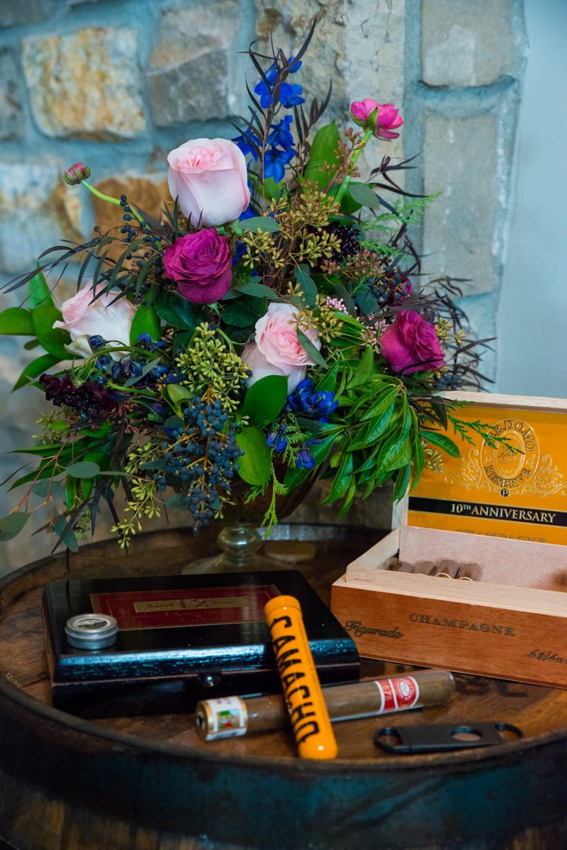 Small tables with cigars and flowers