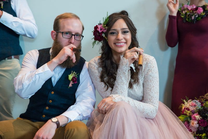 Bride and groom with cigars