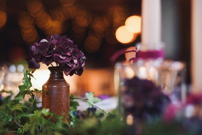 Pot of purple hydrangea on wedding table