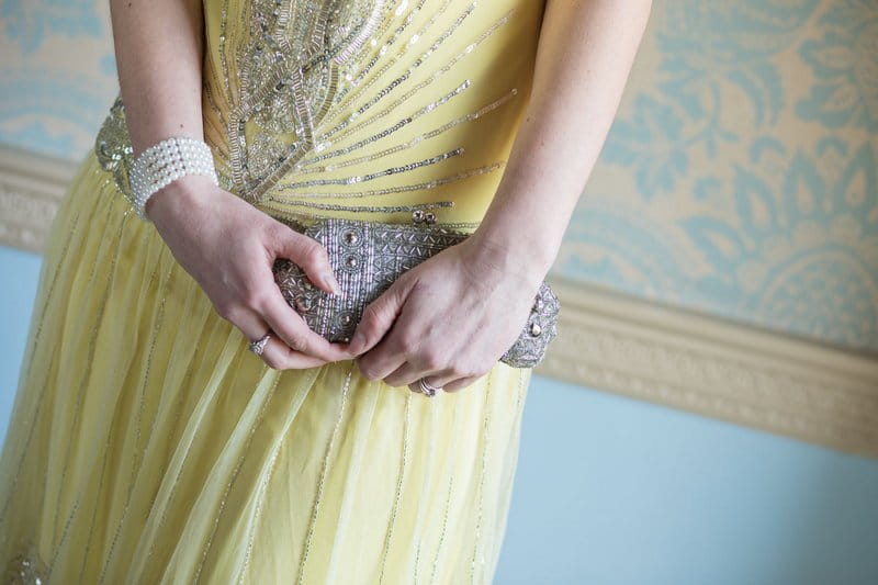 Bridesmaid holding clutch bag