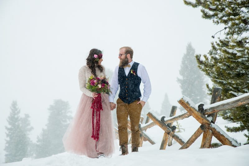 Bride and groom walking in the snow