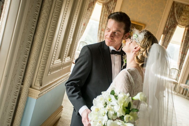 Bride about to kiss groom on the cheek