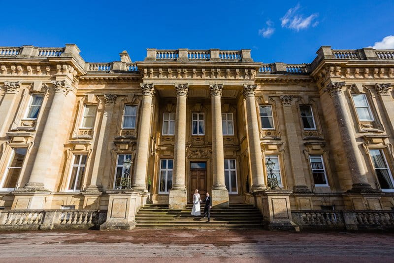 Bride and groom outside Heythrop Park