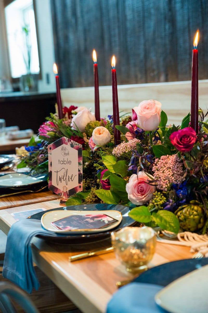 Winter wedding table with colourful floral centrepiece