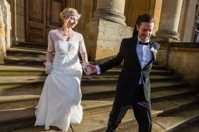 Groom leading bride by the hand