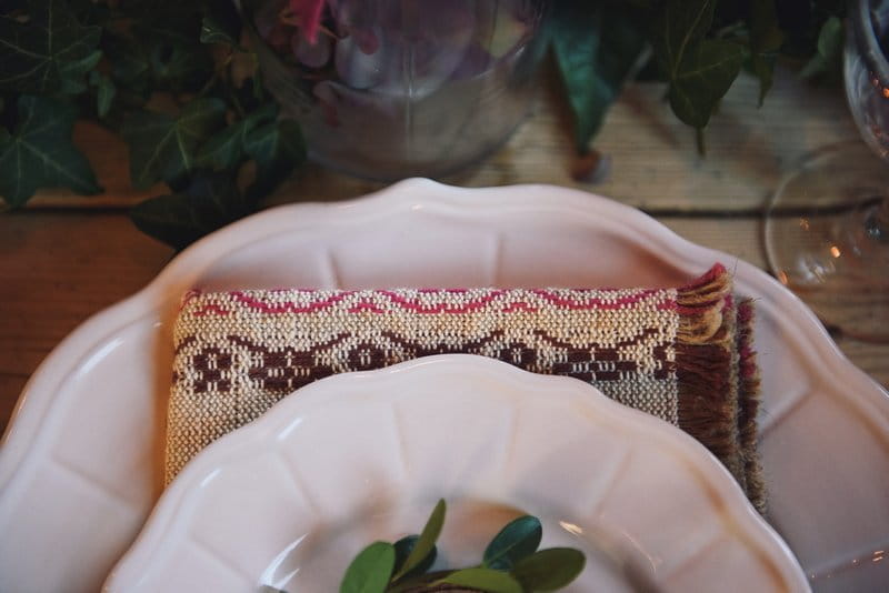 Woven napkin under wedding plate