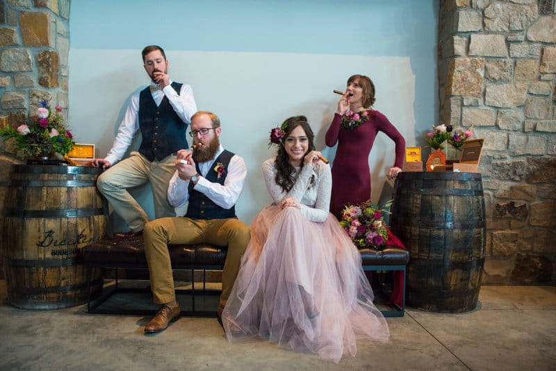 Bridal party posing with cigars at Breckenridge Distillery