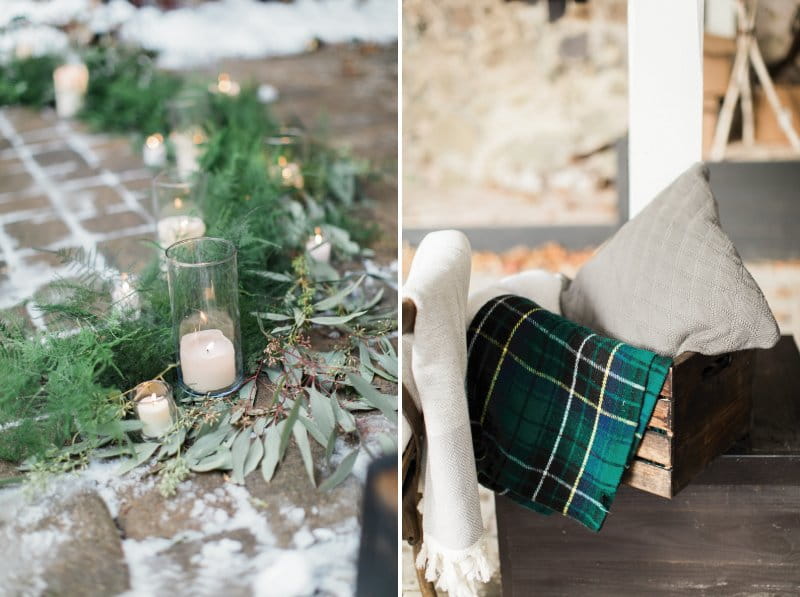 Candles and foliage on ground and box of blankets for winter wedding