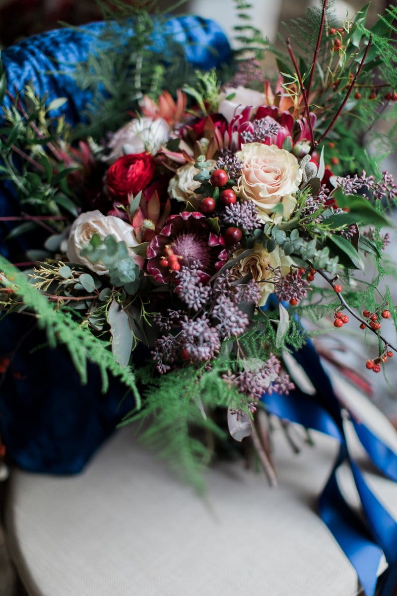 Winter wedding bouquet with burgundy flowers