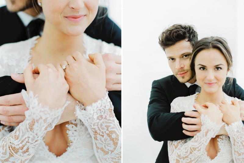 Groom hugging bride from behind