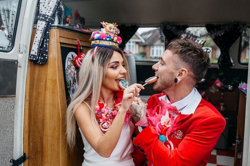 Bride and groom eating lollipops