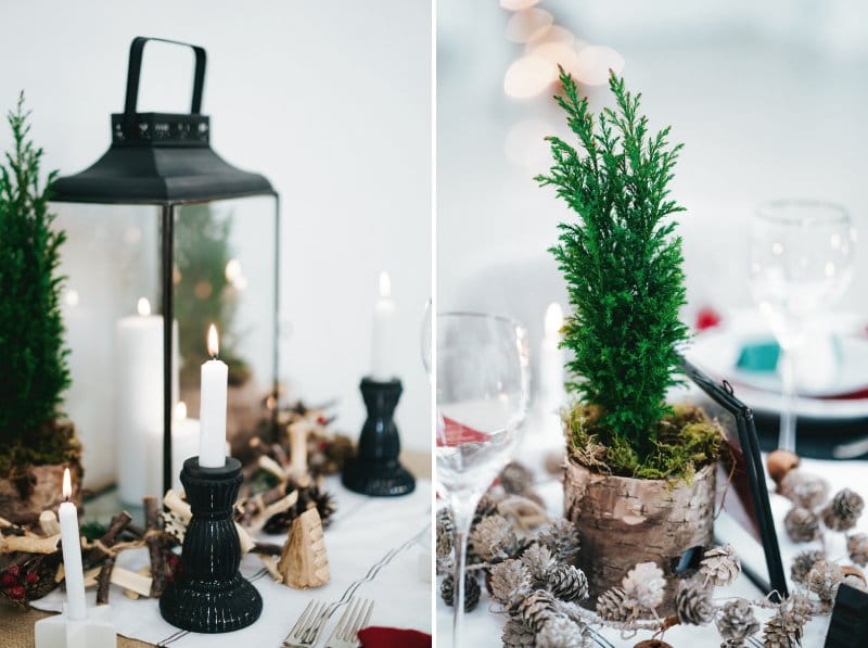 Lanterns, candles and fir tree on wedding table