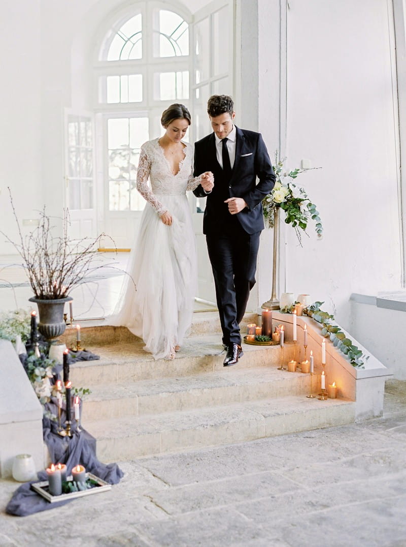 Bride and groom walking down steps