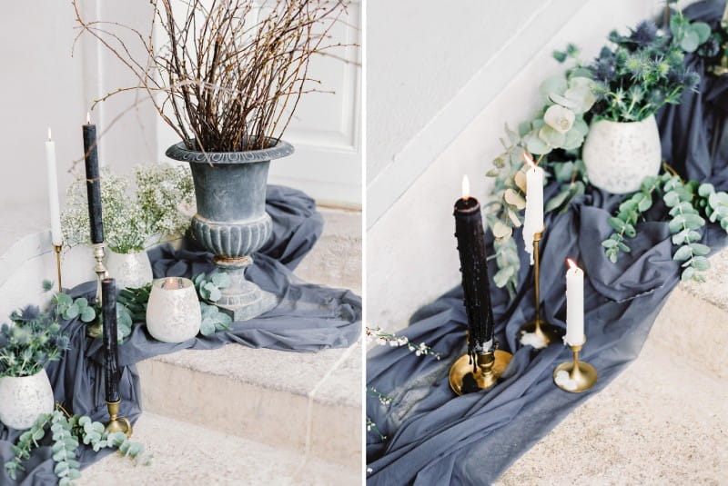 Candles and pots on grey cloth lining steps