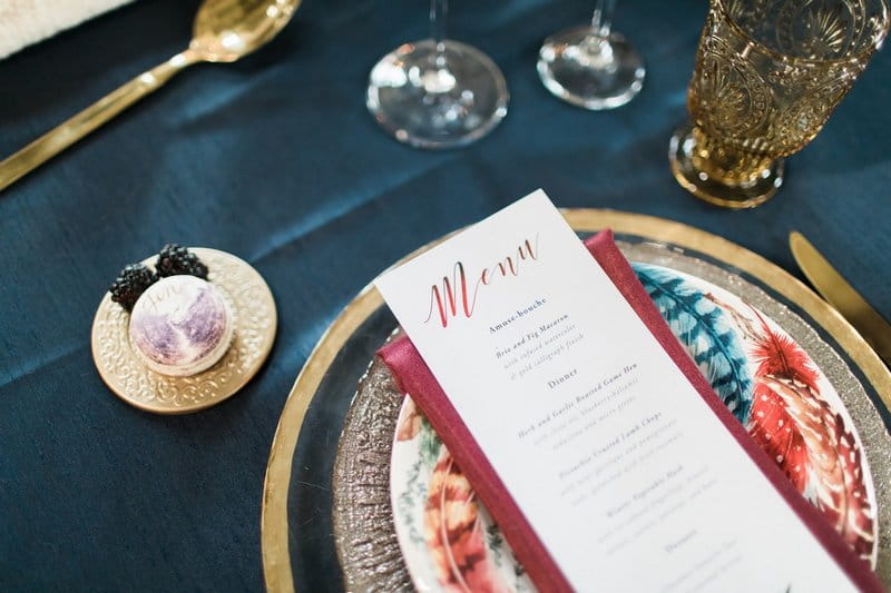 Winter wedding menu on burgundy napkin