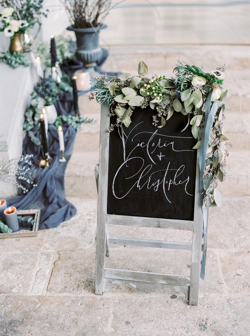 Wedding chalkboard sign decorated in foliage