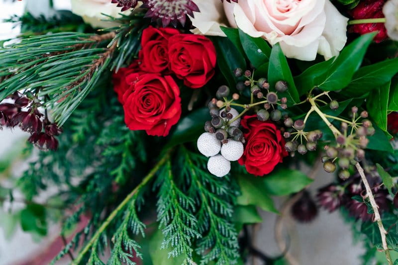 Red roses and foliage of wedding bouquet