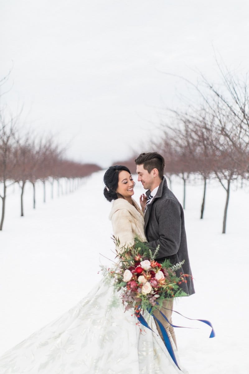 Bride and groom in snow