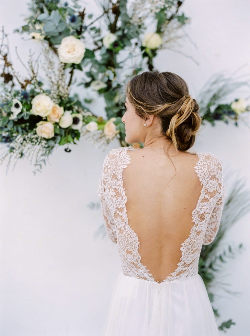 Bride showing open back of wedding dress