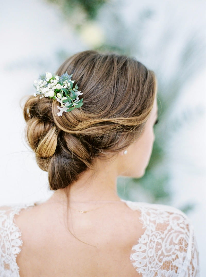 Winter foliage in bride's updo hairstyle