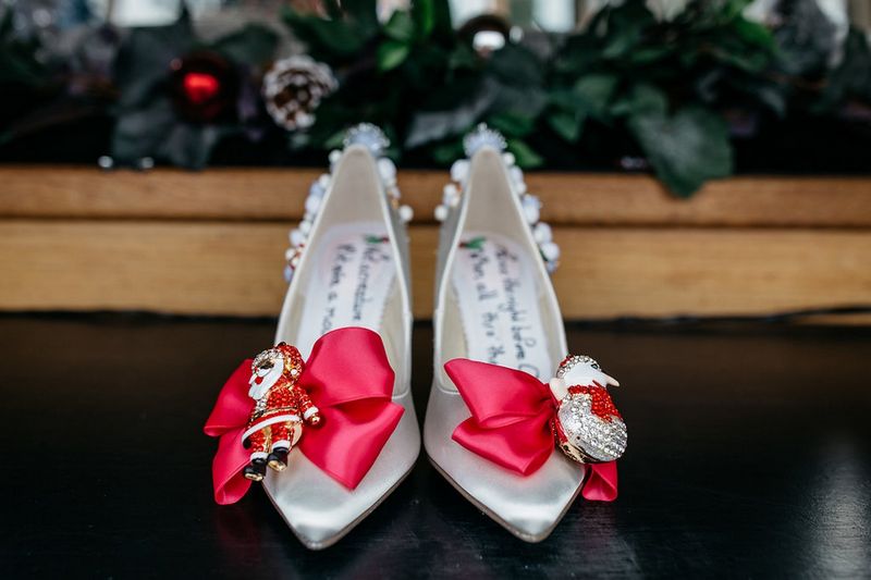 Christmas wedding shoes with red ribbon and Santa and snowman figured on front