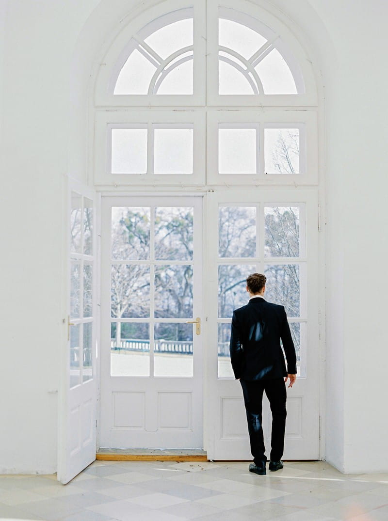 Groom looking out of window