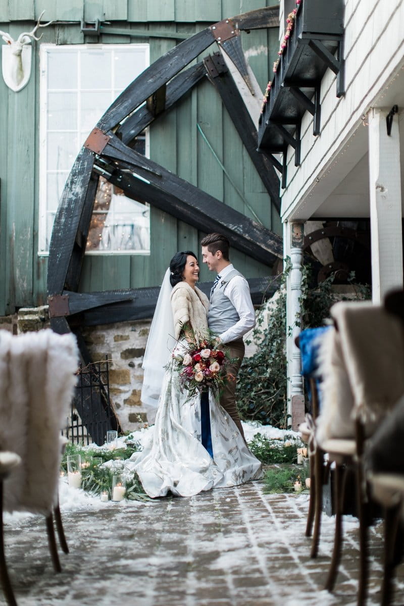 Bride and groom by wheel of Willowbrook Mill, Michigan