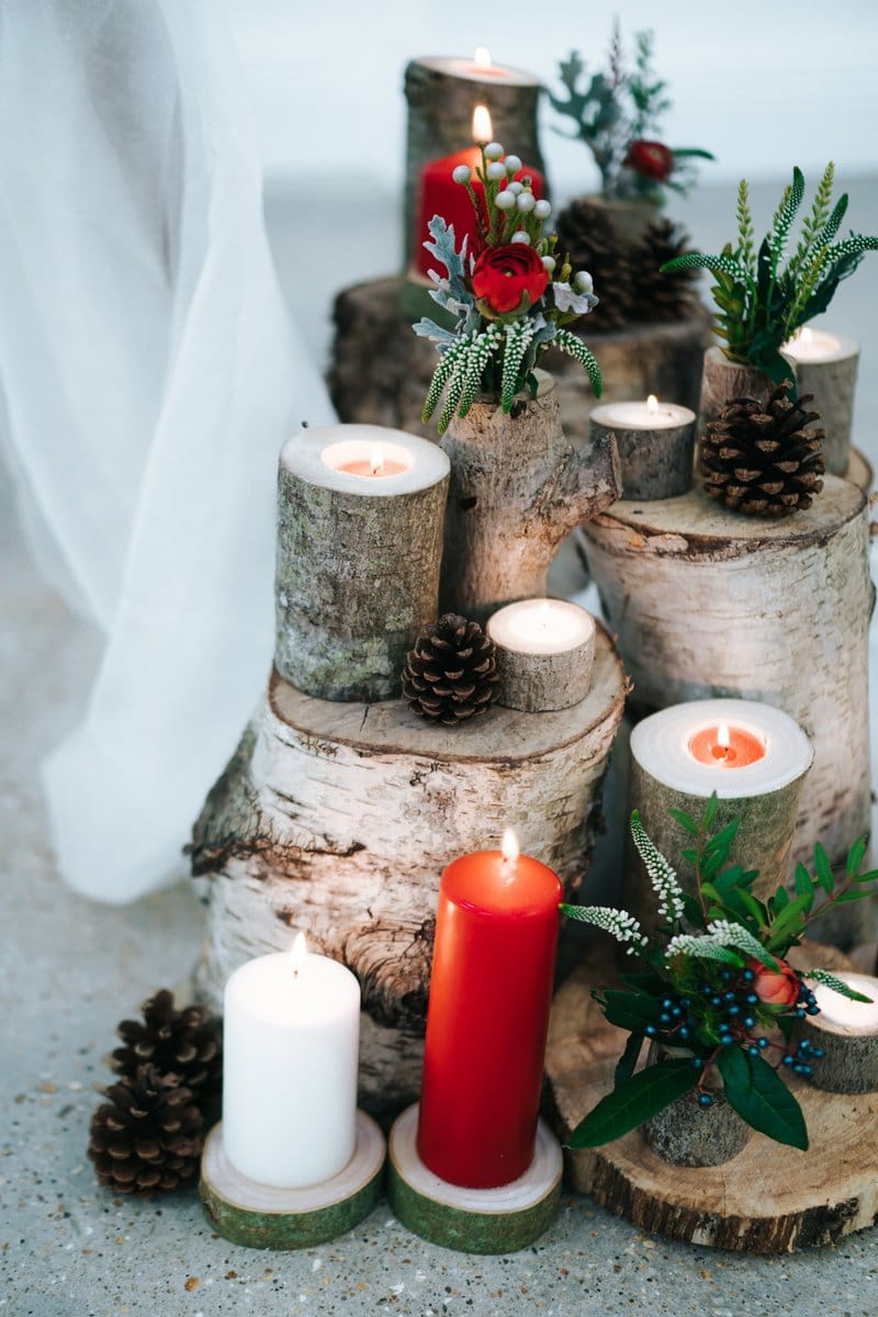 Logs and candles winter wedding display