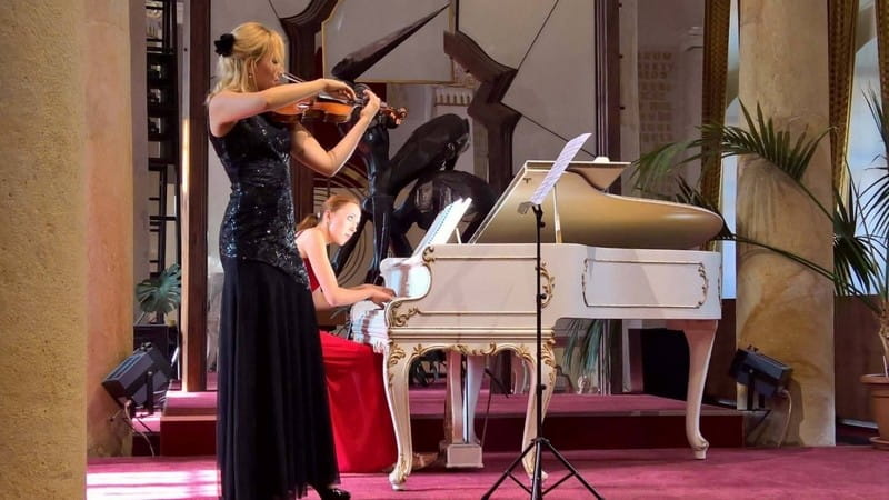 Pianist and violinist performing together