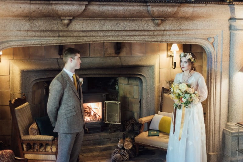 Bride and groom by fireplace at Coombe Trenchard for elopement