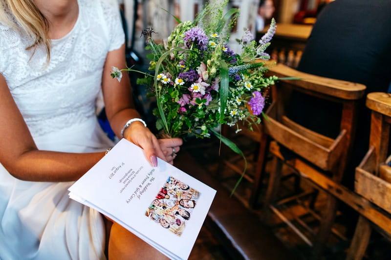 Bridesmaid holding bouquet and order of service