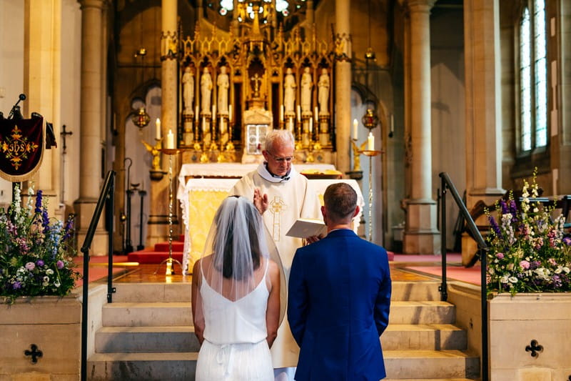 Vicar conducting wedding ceremony