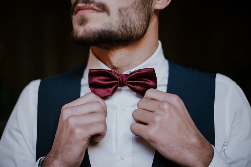 Groom's red bow tie