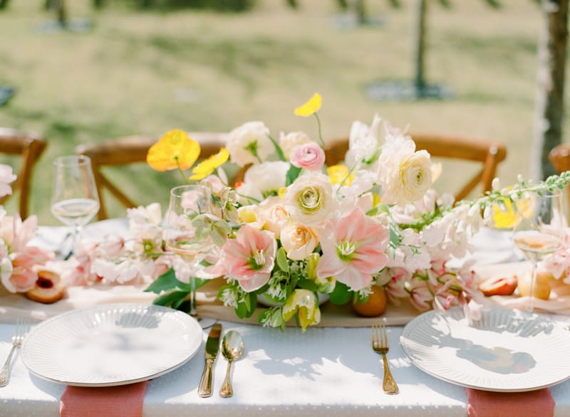 Yellow and peach floral wedding table centrepiece