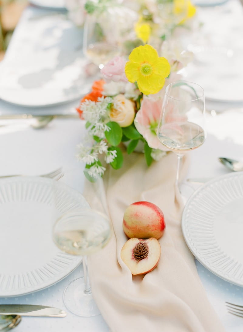 Wedding table runner with yellow flowers and peach