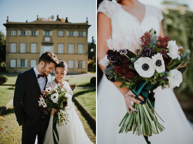 Bride holding winter bouquet with red flowers and white anemones