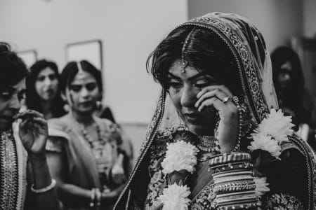 Indian bride wiping away tear - Picture by Embee Photography