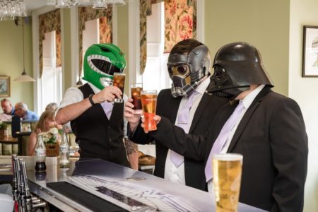 Groomsmen at bar wearing Power Ranger and Star Wars masks - Picture by Penny Young Photography