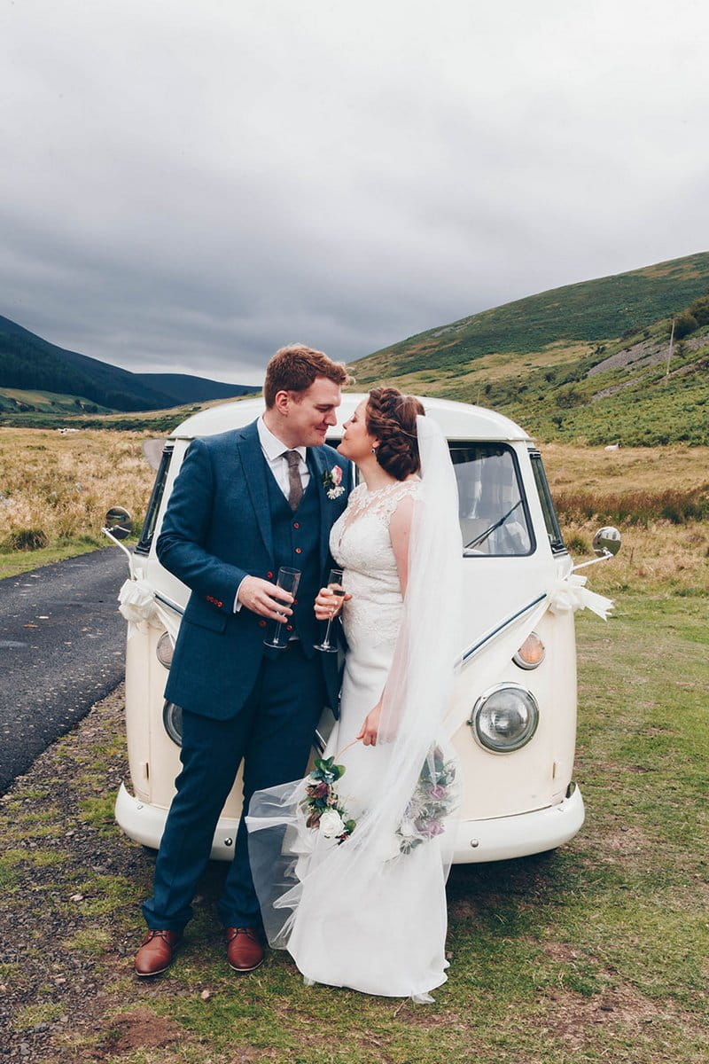 Bride and groom in front of VW camper van