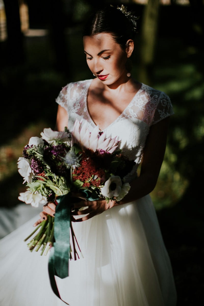 Bride holding winter bouquet