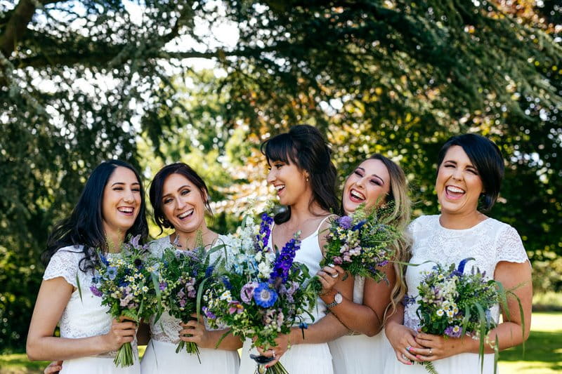 Bride and bridesmaids holding bouquets